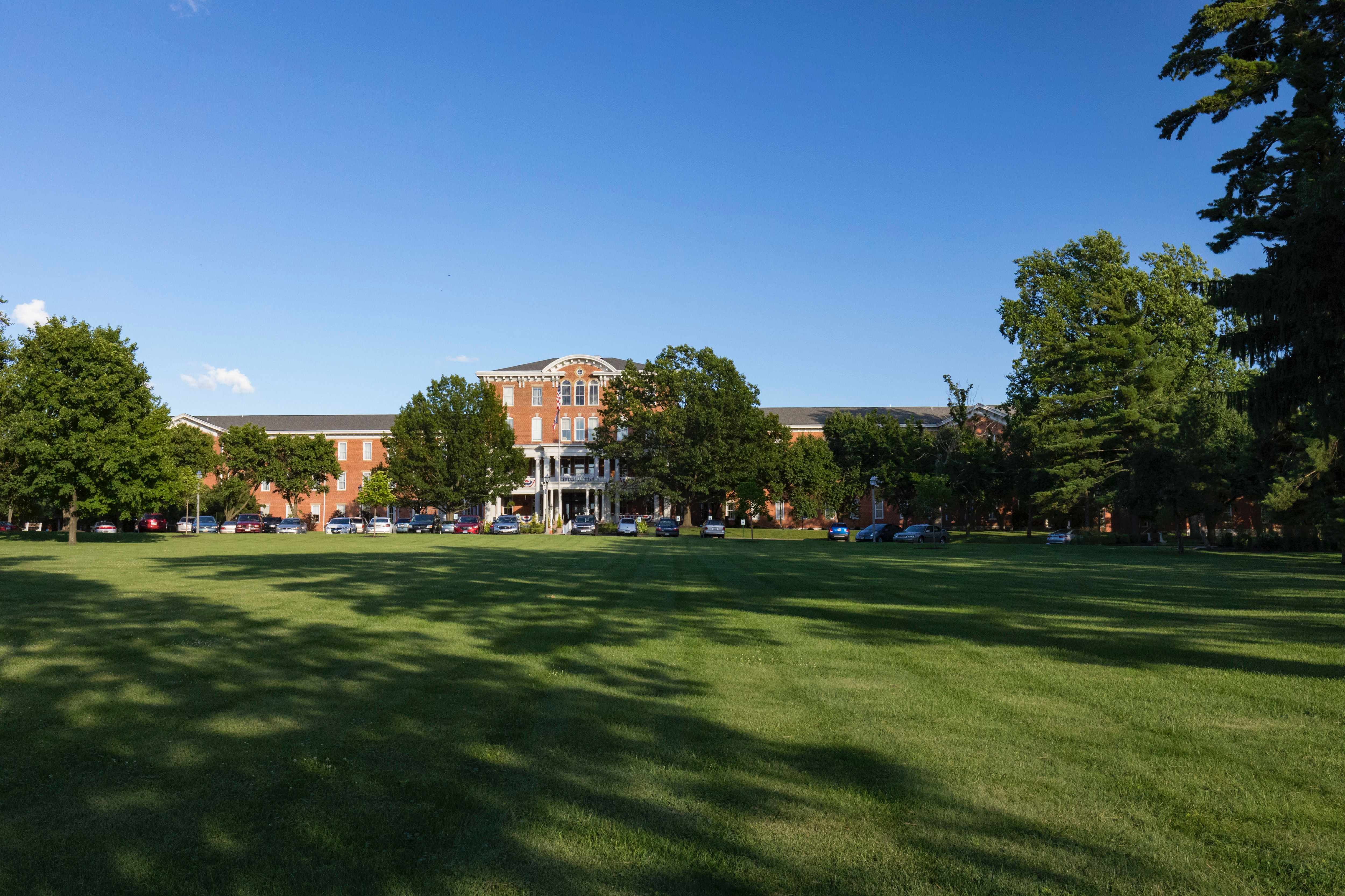 The front of 10 Wilmington Place building and grounds on a sunny day in Dayton, Ohio
