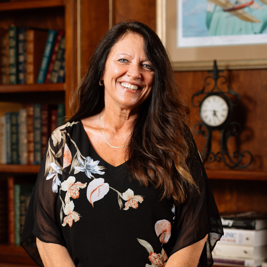 Dolores Kramer, Sales Counselor at 10 Wilmington Place, smiles for the camera