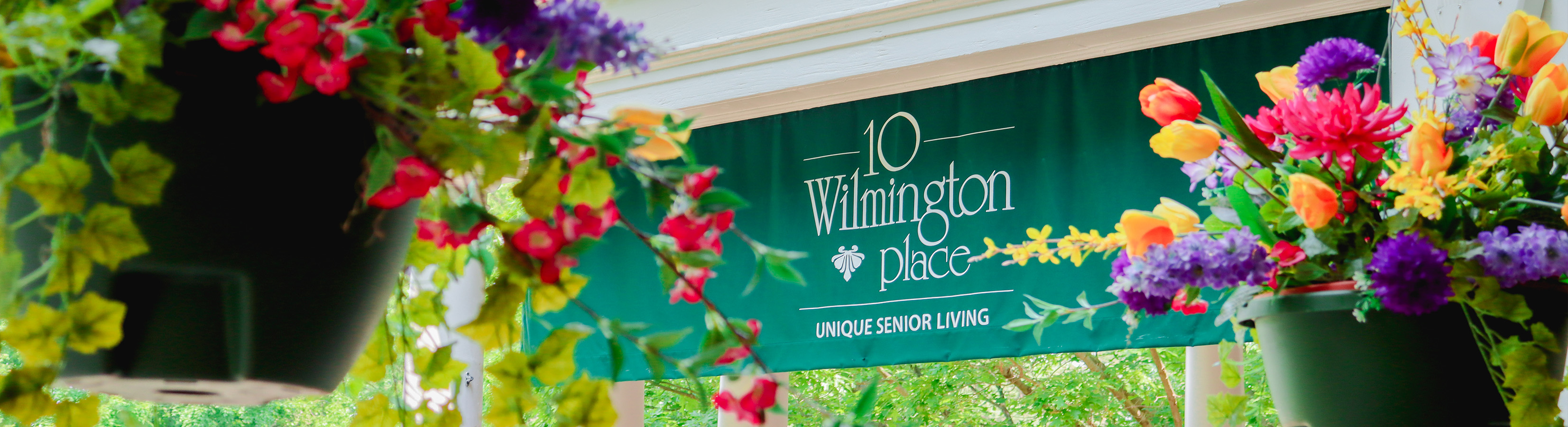 10-Wilmington-Place's-front-entrance-in-Dayton-Ohio-with-beautiful-landscaping-10-Wilmington-Place-is-a-retirement-living-community-in-the-dayton-and-surrounding-areas-for-independent-living-assisted-living-and-memory-care