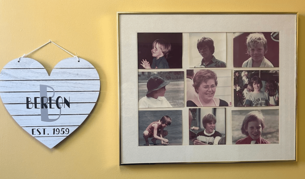 A heart with Berlon Est. 1959 hanging from the wall is on the left and a collage of nine family photos is on the right