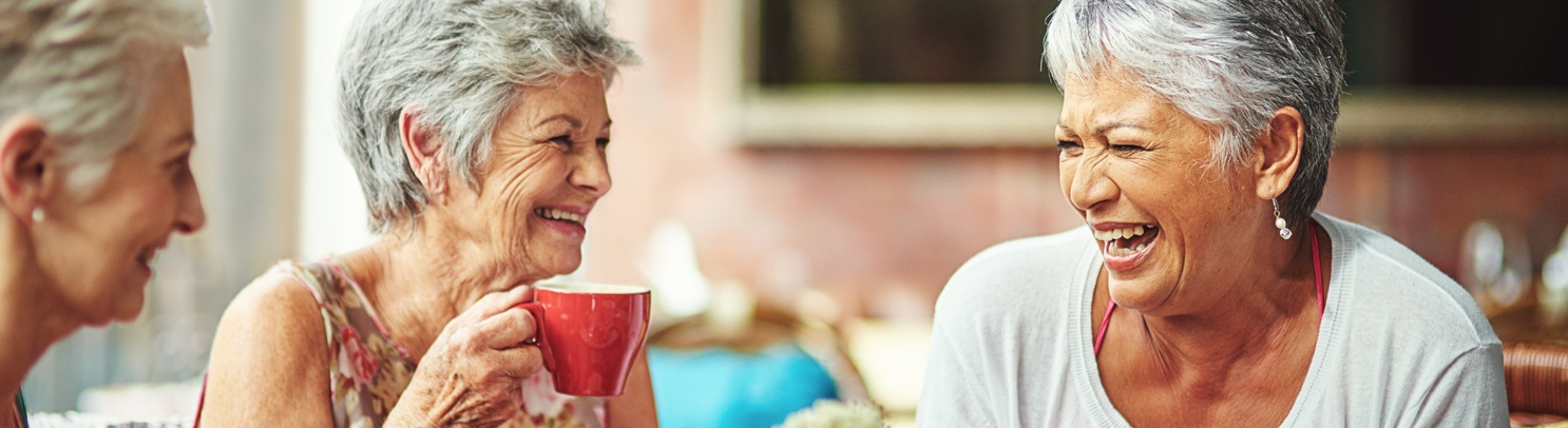 10 Wilmington Place female residents laugh together while drinking tea
